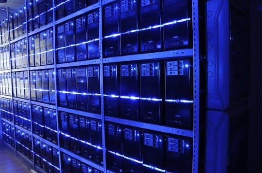 Rows of blue-lit servers inside a data center